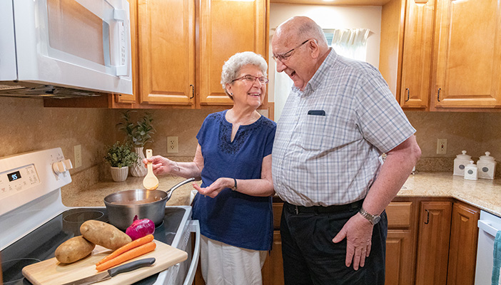 couple cooking in kitchen